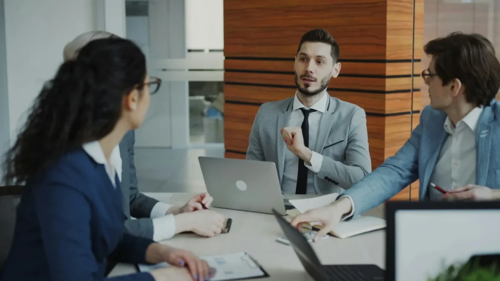 Business advisers discussing financial plans in a modern office